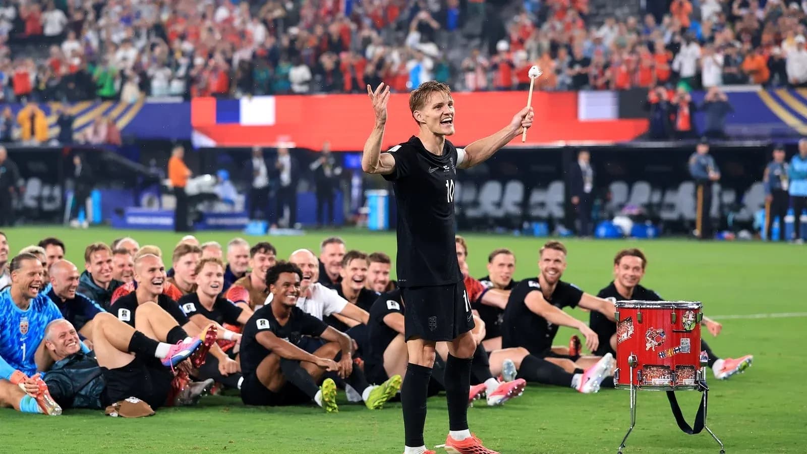 Player celebrating with teammates after match victory Player celebrating with teammates after match victory