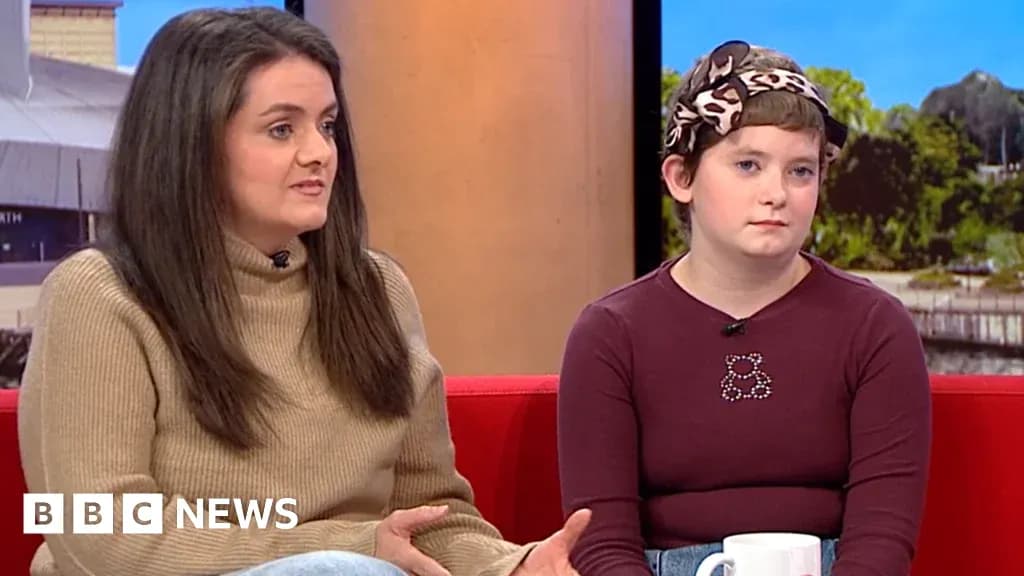 Two women discussing on a talk show set Two women discussing on a talk show set