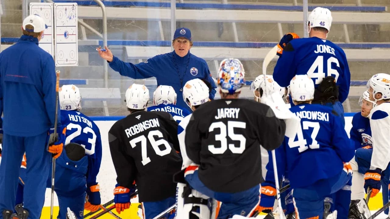 Coach instructing players during a hockey training session Coach instructing players during a hockey training session