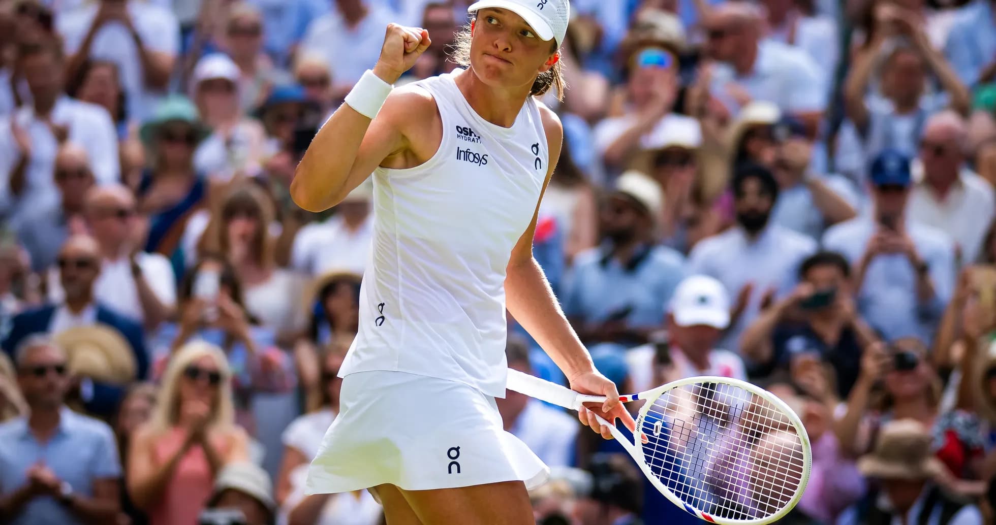Tennis player celebrating in front of crowd Tennis player celebrating in front of crowd