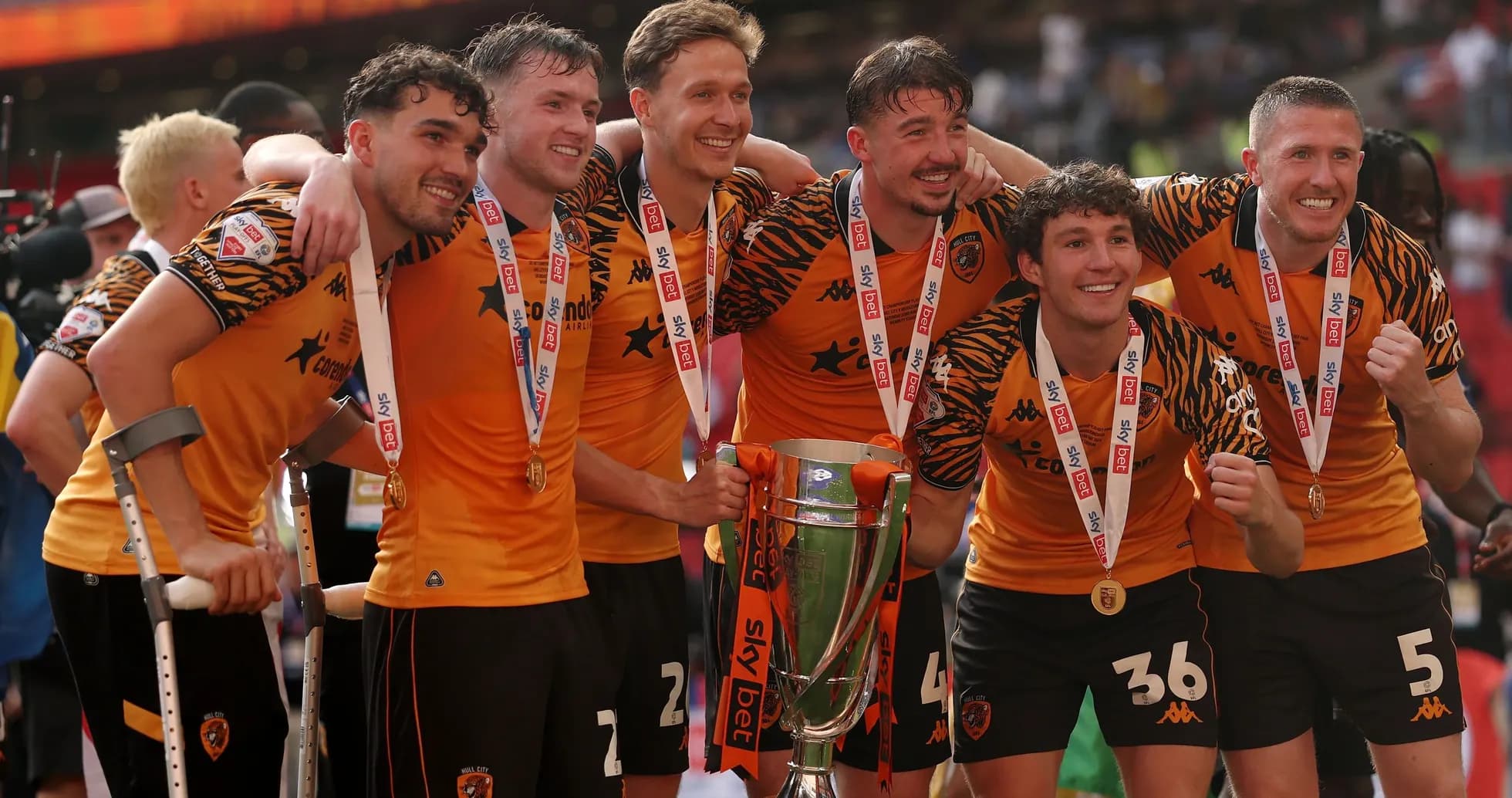 Hull City players celebrating with trophy after victory Hull City players celebrating with trophy after victory