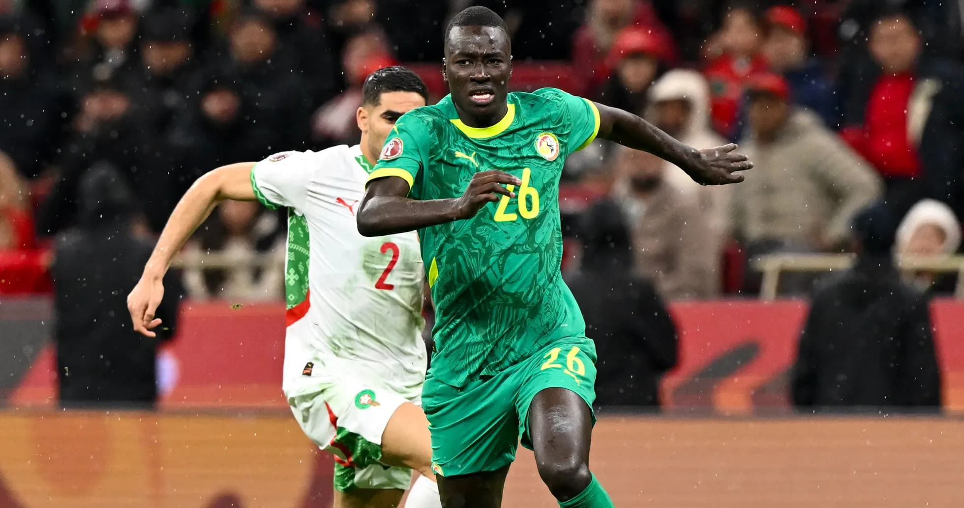 Senegal player running with ball during match Senegal player running with ball during match