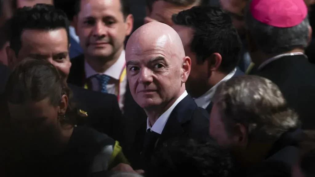 Man in suit surrounded by a crowd of people Man in suit surrounded by a crowd of people