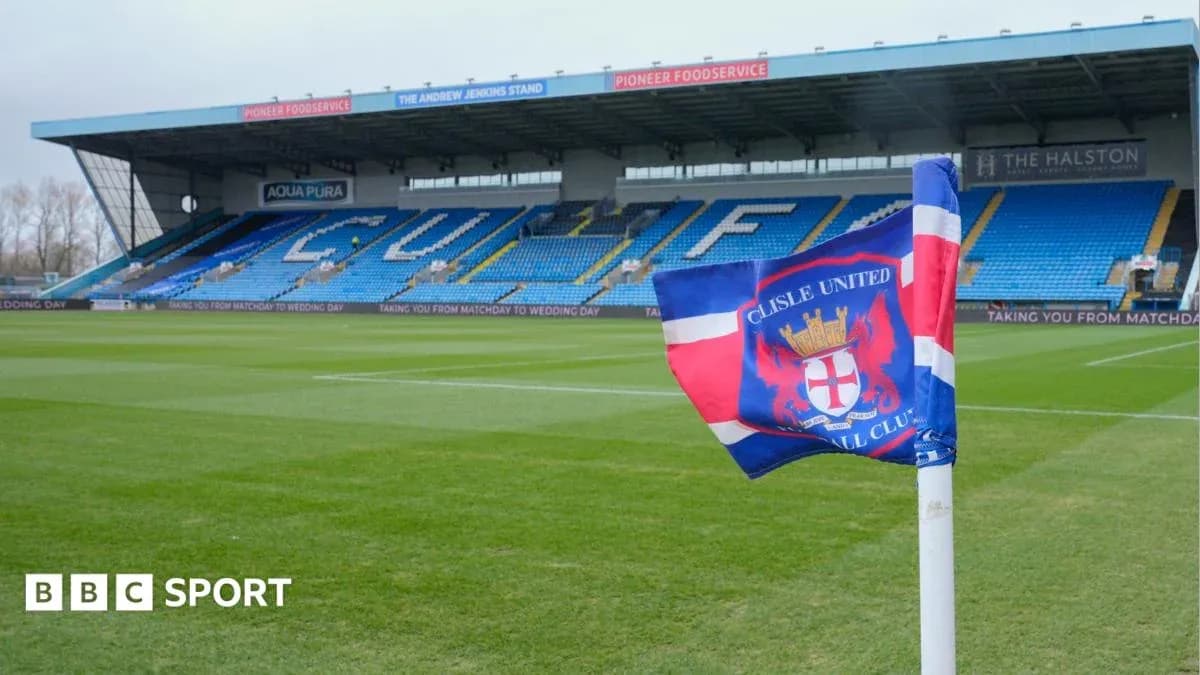 Carlisle United flag in front of stadium seating Carlisle United flag in front of stadium seating