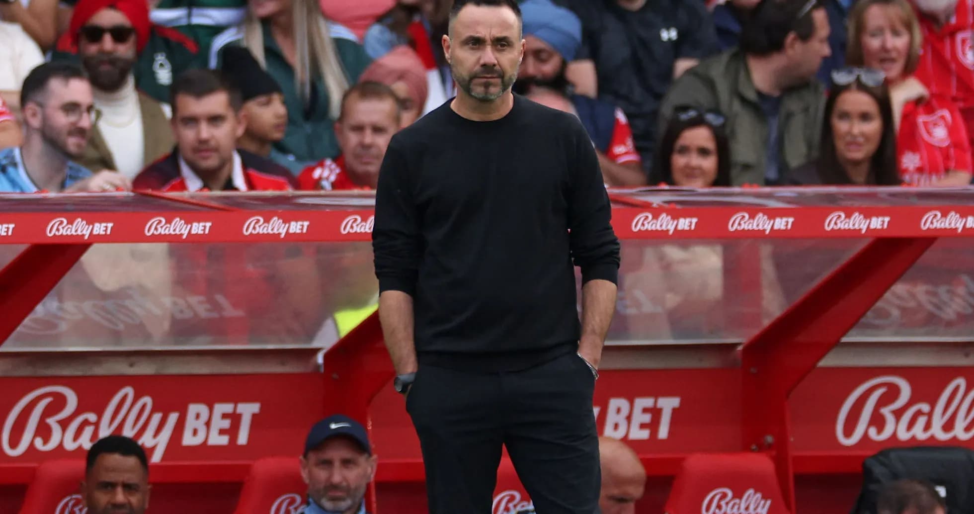 Coach observing match from sideline bench Coach observing match from sideline bench