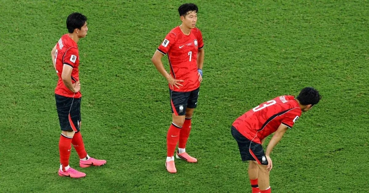 Three South Korean players on the field after match Three South Korean players on the field after match