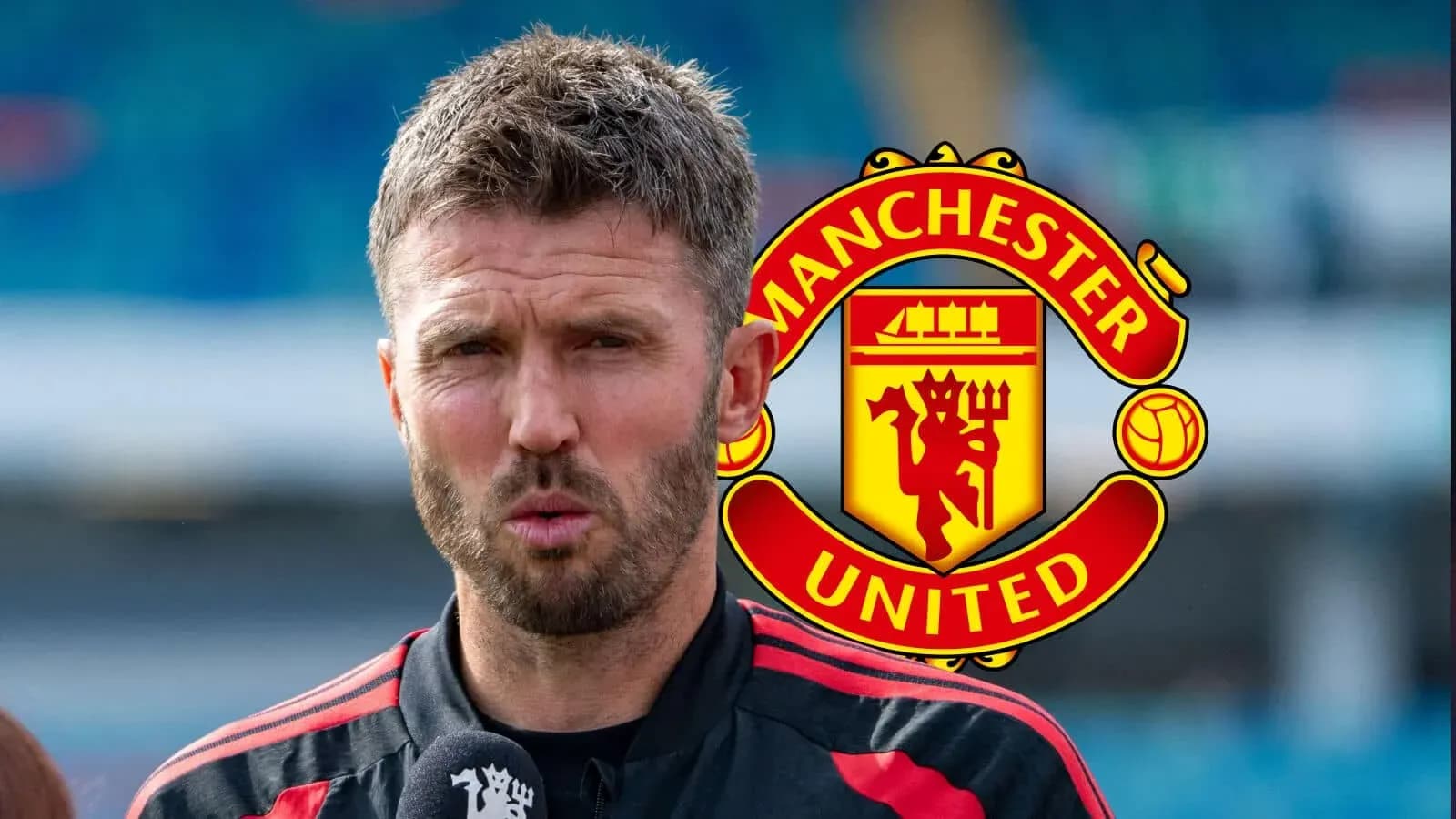 Man speaking during press conference with Manchester United logo Man speaking during press conference with Manchester United logo