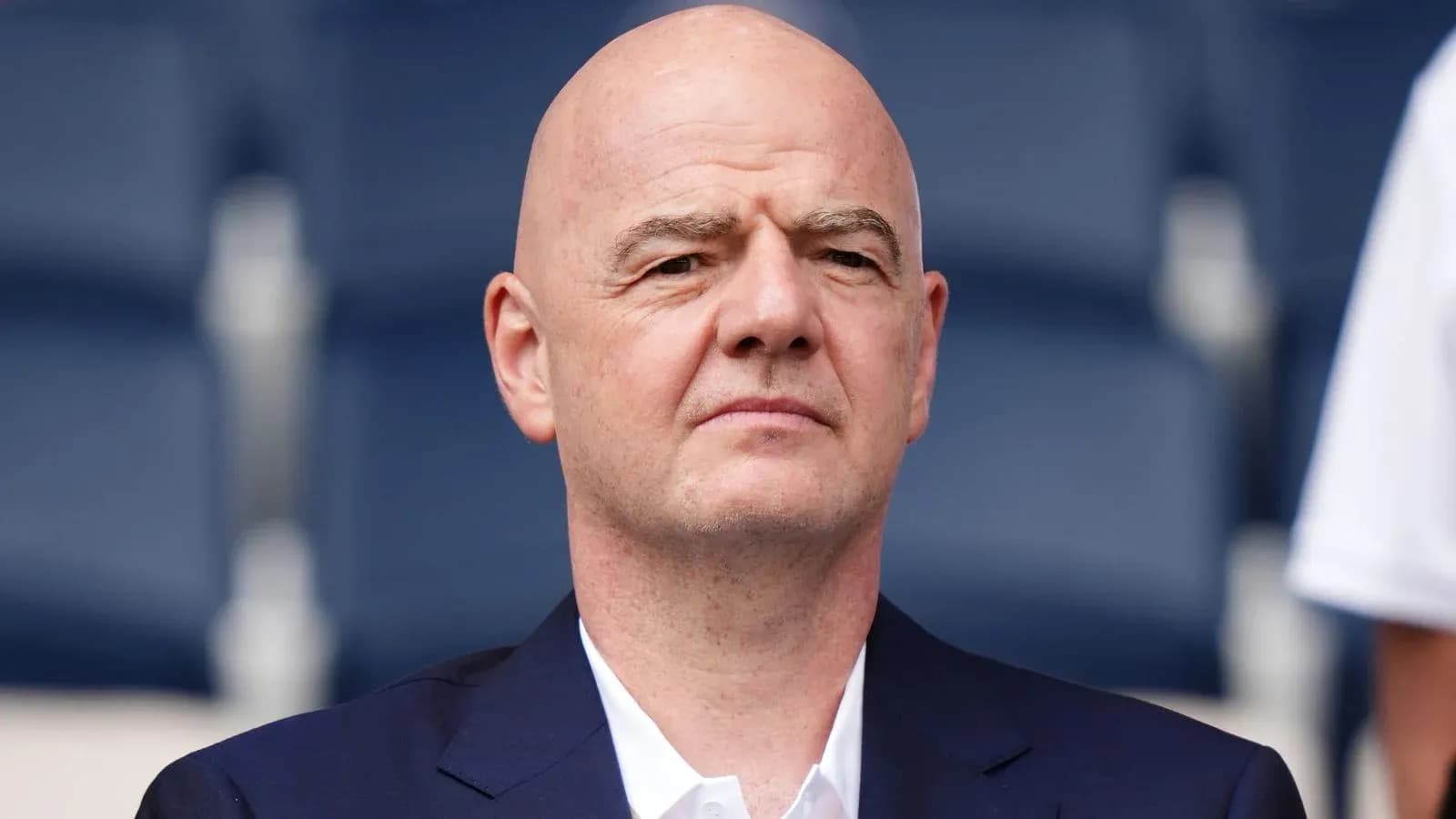 Bald man in a suit at an event Bald man in a suit at an event