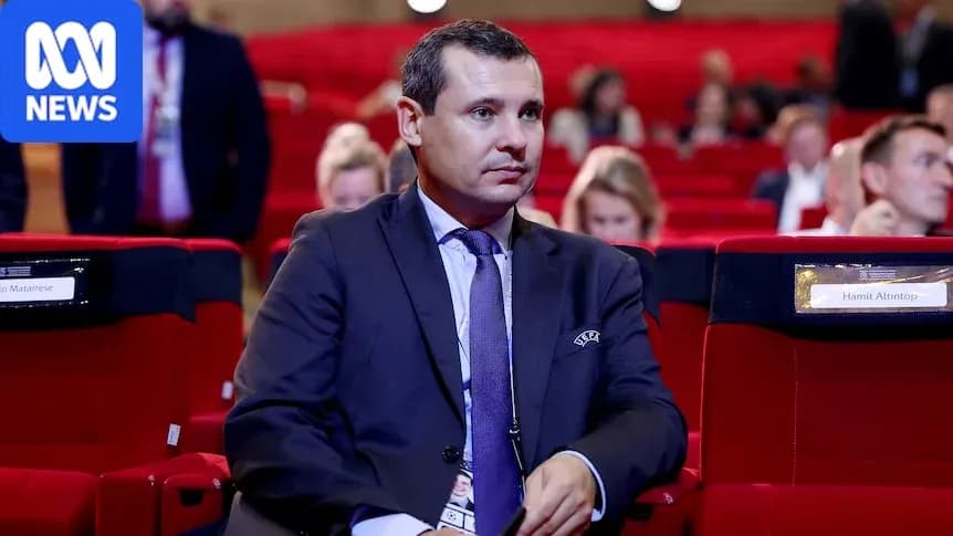 Man seated in auditorium during conference event Man seated in auditorium during conference event