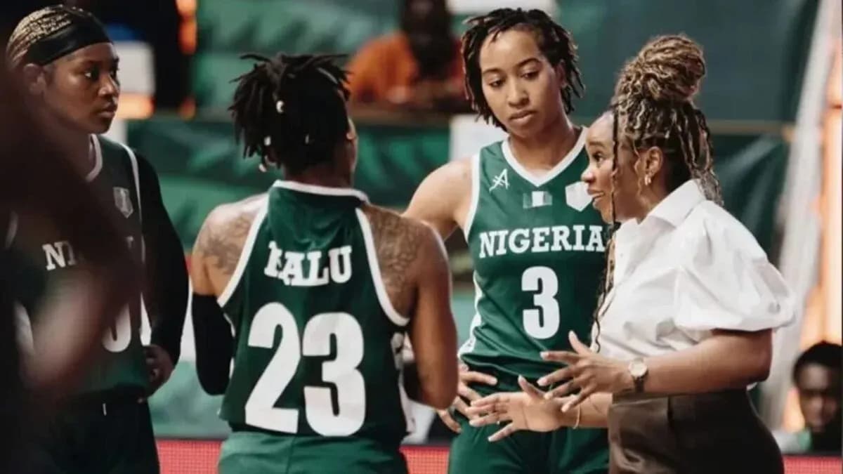 Nigeria women's basketball team discussing strategy during timeout Nigeria women's basketball team discussing strategy during timeout