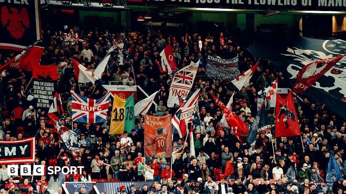 Football fans waving flags in the stadium Football fans waving flags in the stadium