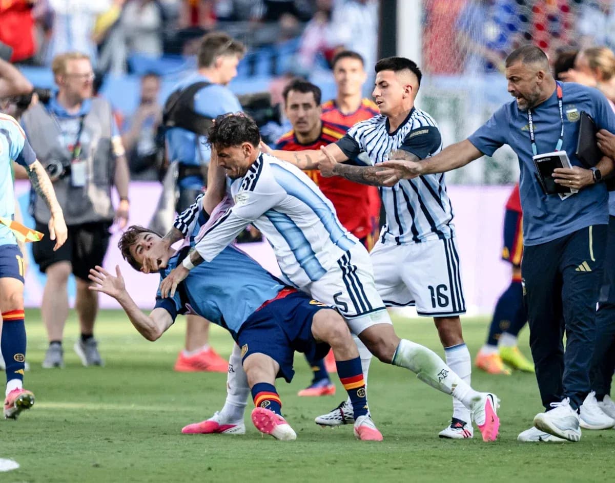 Players clashing during intense football match action Players clashing during intense football match action