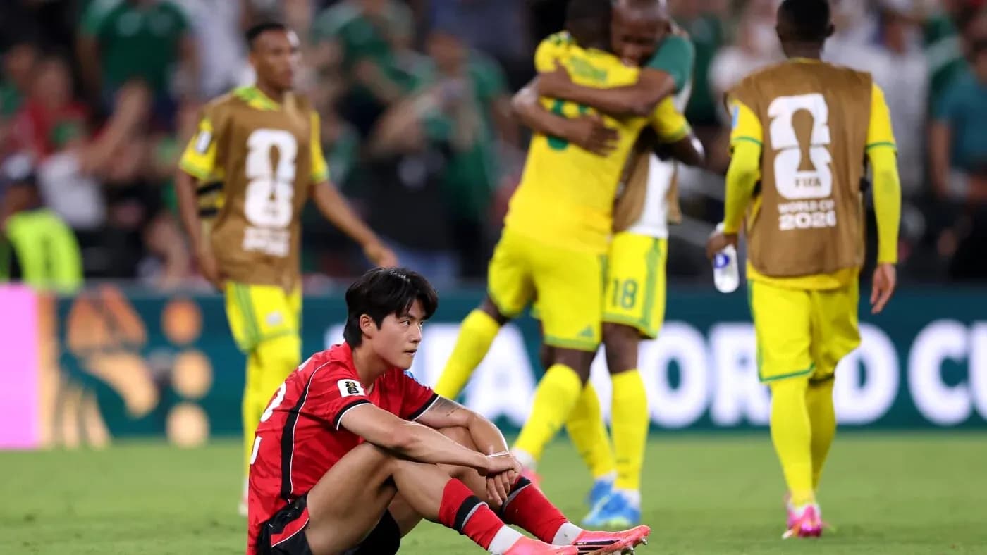 South Korean player sitting on field after match South Korean player sitting on field after match