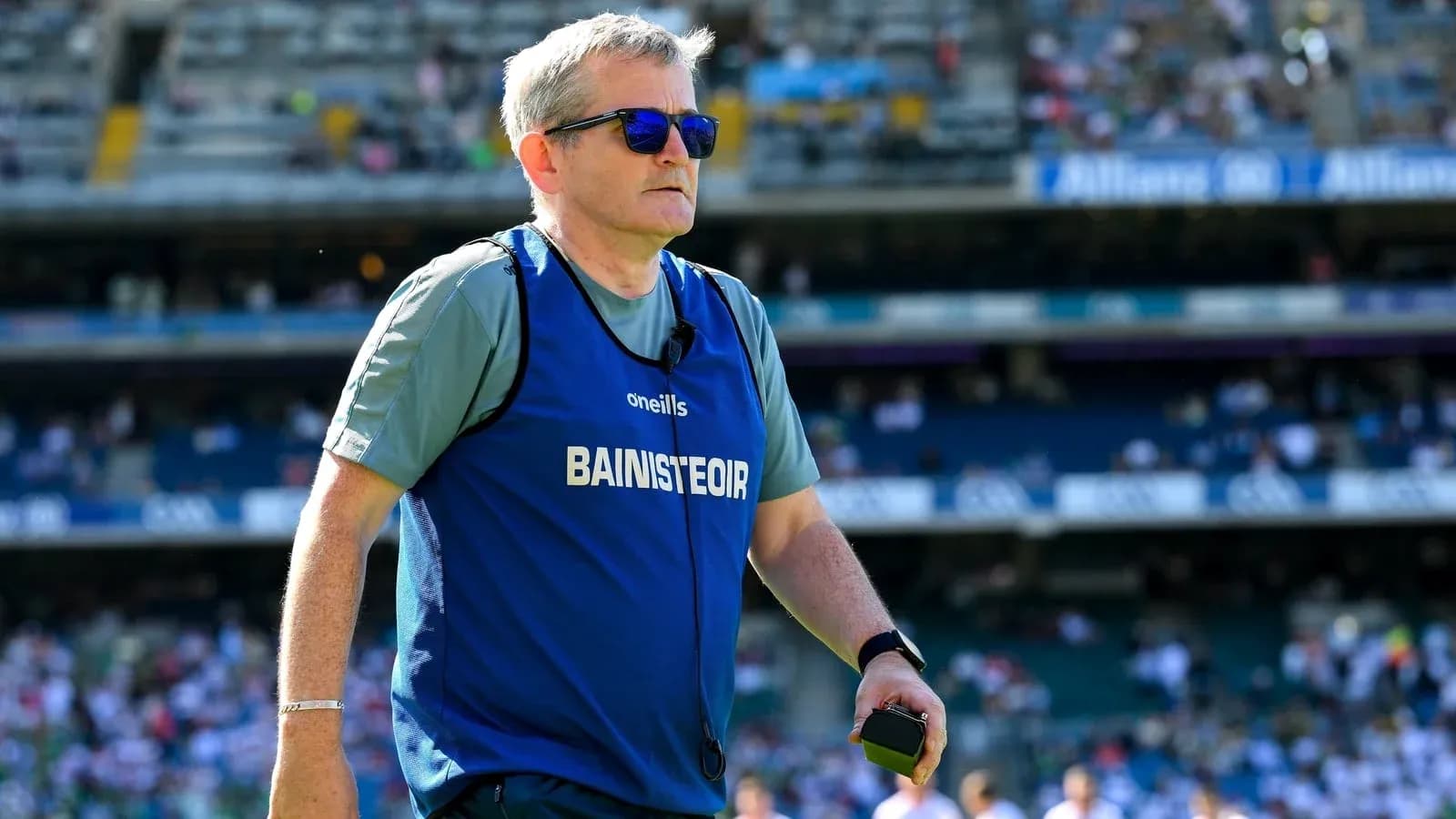 Coach wearing sunglasses on the pitch during match Coach wearing sunglasses on the pitch during match