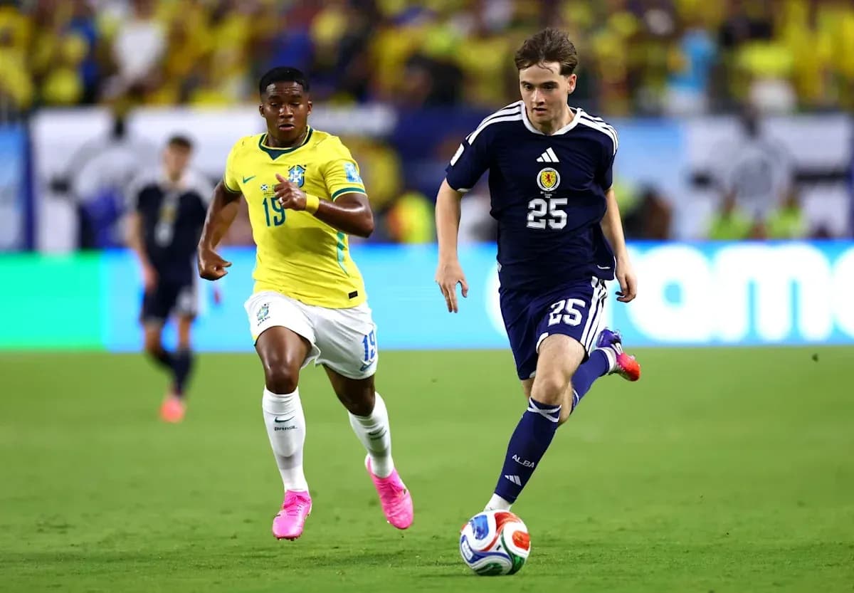 Brazil and Scotland players competing for the ball Brazil and Scotland players competing for the ball
