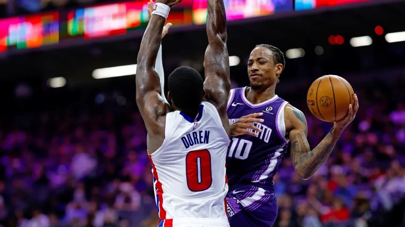 Player attempting a shot while being defended Player attempting a shot while being defended