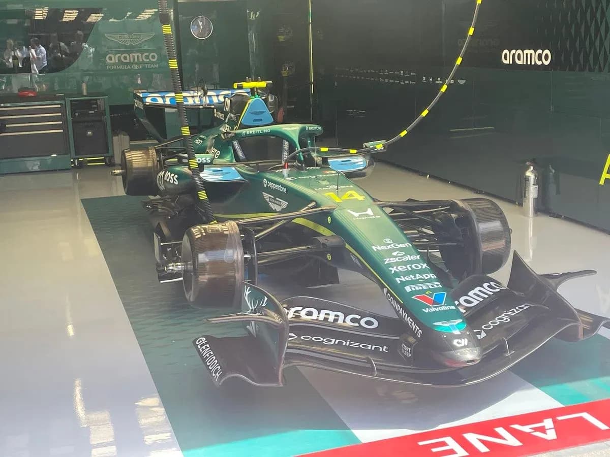 Aston Martin Formula 1 car in garage Aston Martin Formula 1 car in garage