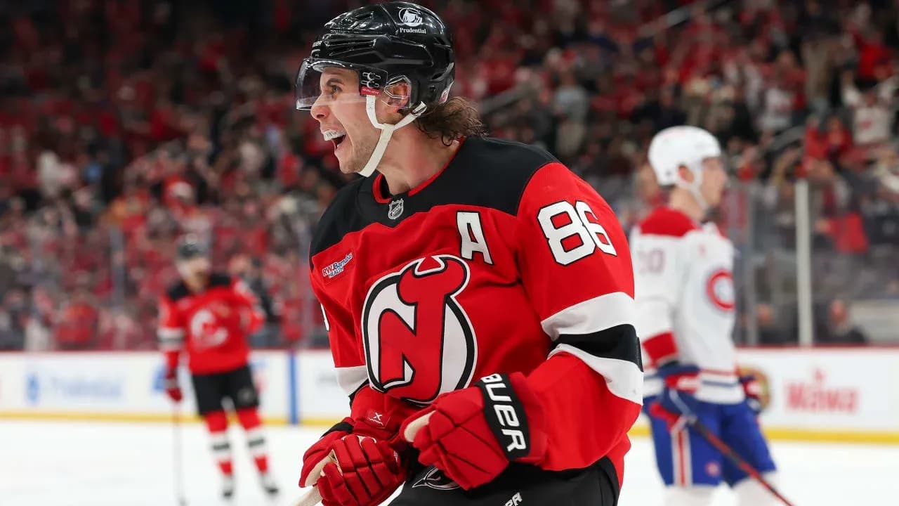 Hockey player celebrating in New Jersey Devils jersey Hockey player celebrating in New Jersey Devils jersey