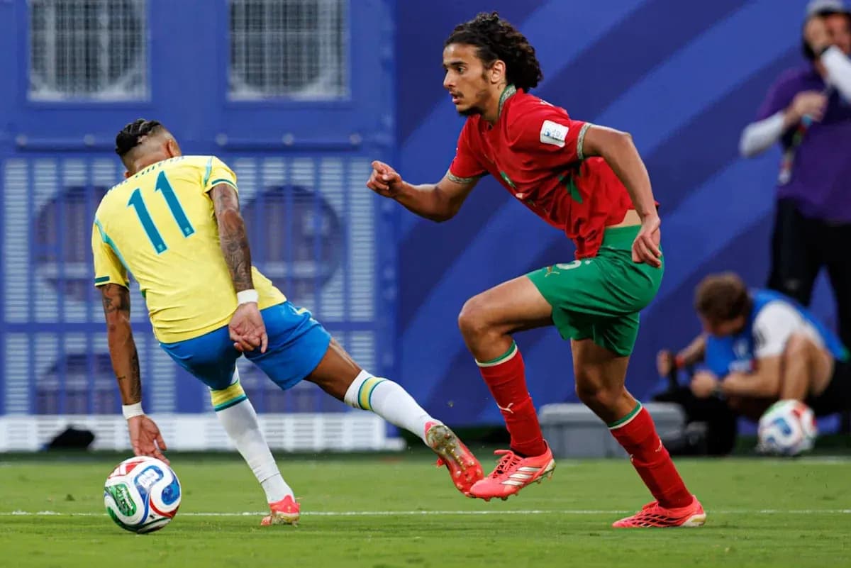 Brazillian player dribbling past Moroccan defender Brazillian player dribbling past Moroccan defender