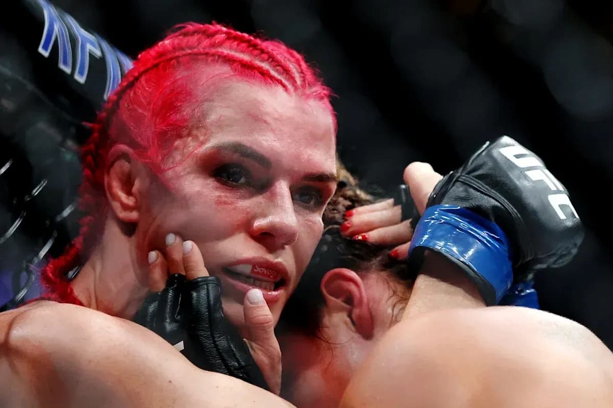 Two fighters grappling during UFC match Two fighters grappling during UFC match