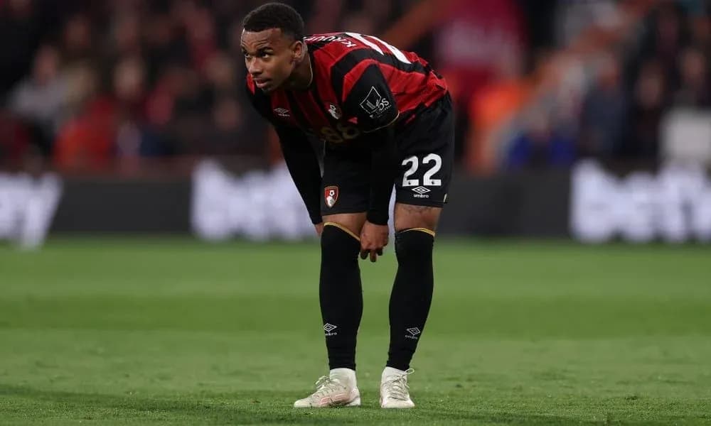 Bournemouth player bending over on the pitch Bournemouth player bending over on the pitch