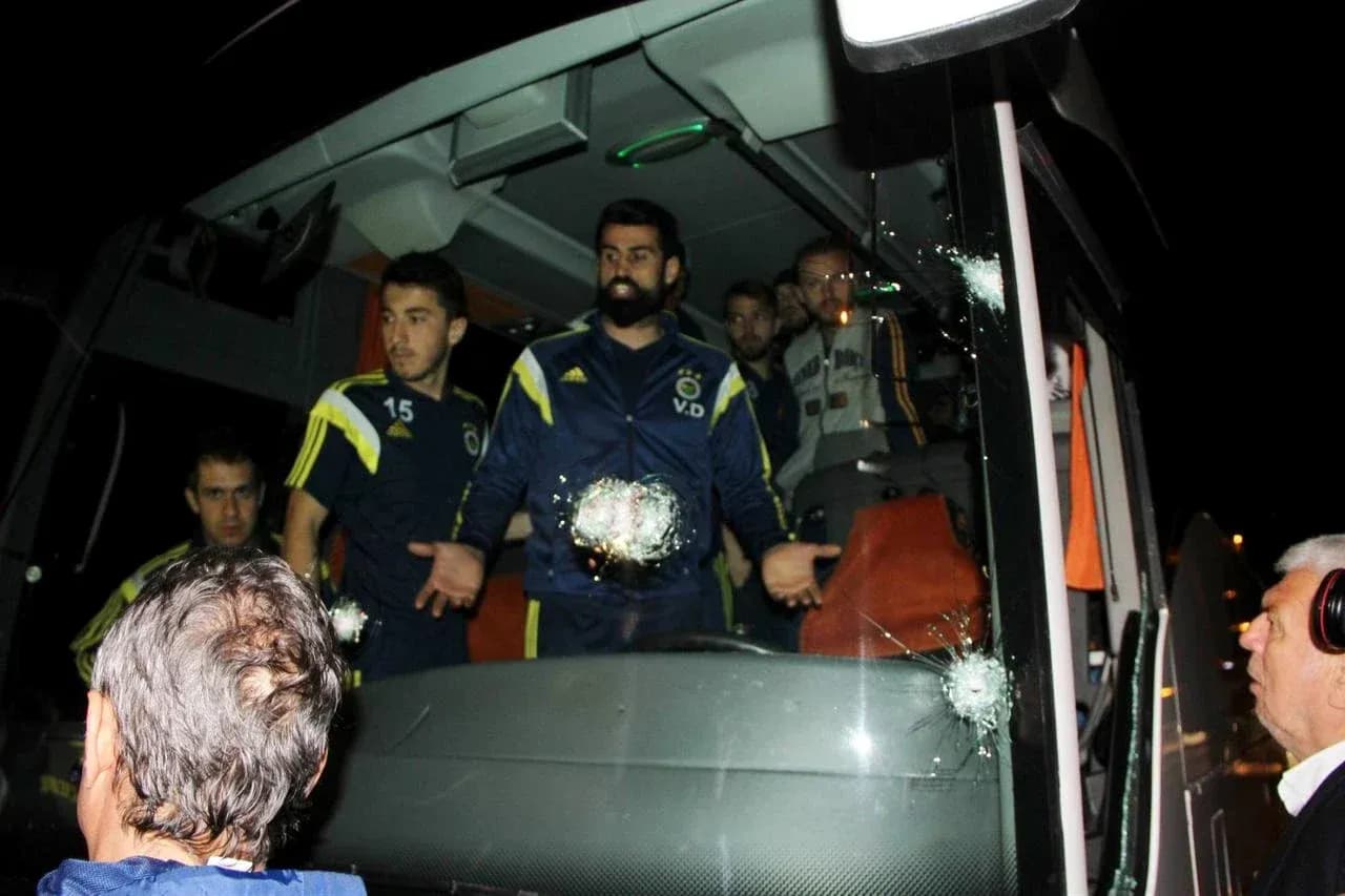 Fenerbahçe players on bus with bullet holes Fenerbahçe players on bus with bullet holes