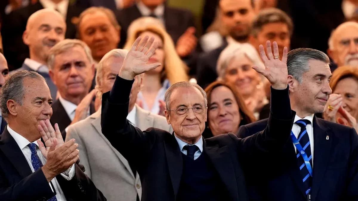 People applauding at an event, with one man waving People applauding at an event, with one man waving