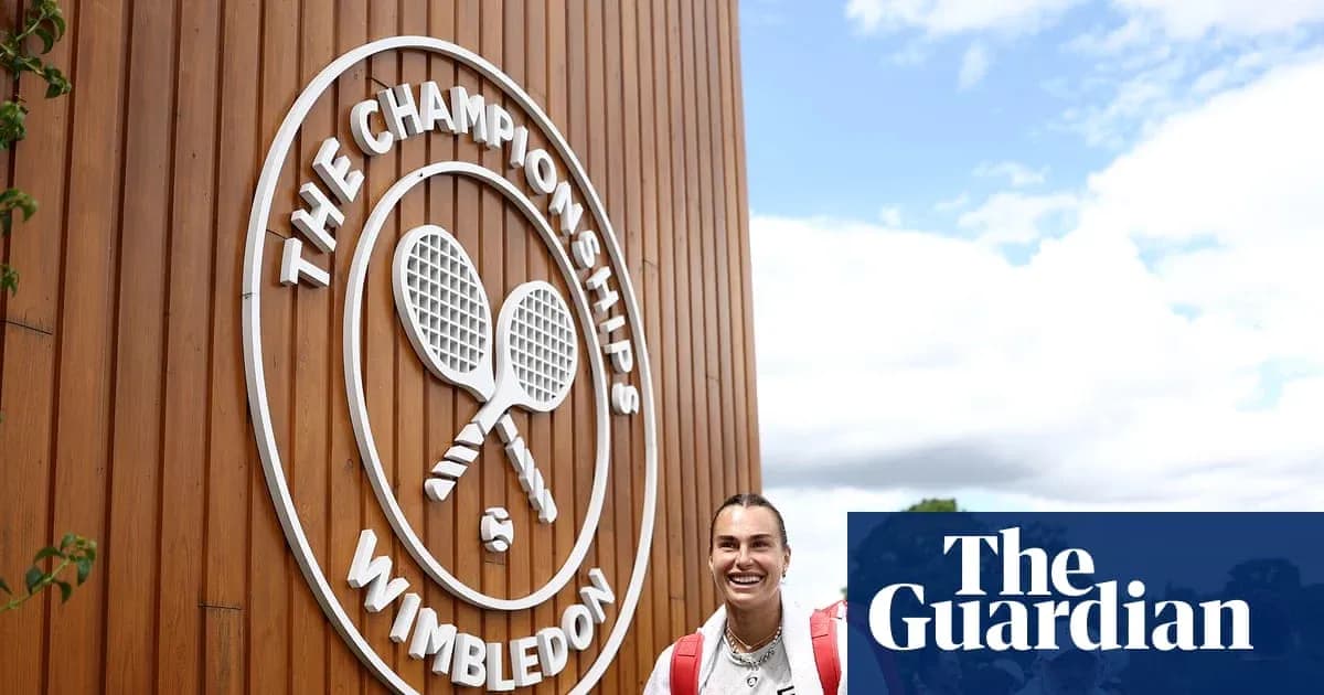 Tennis player smiling near Wimbledon Championships sign Tennis player smiling near Wimbledon Championships sign