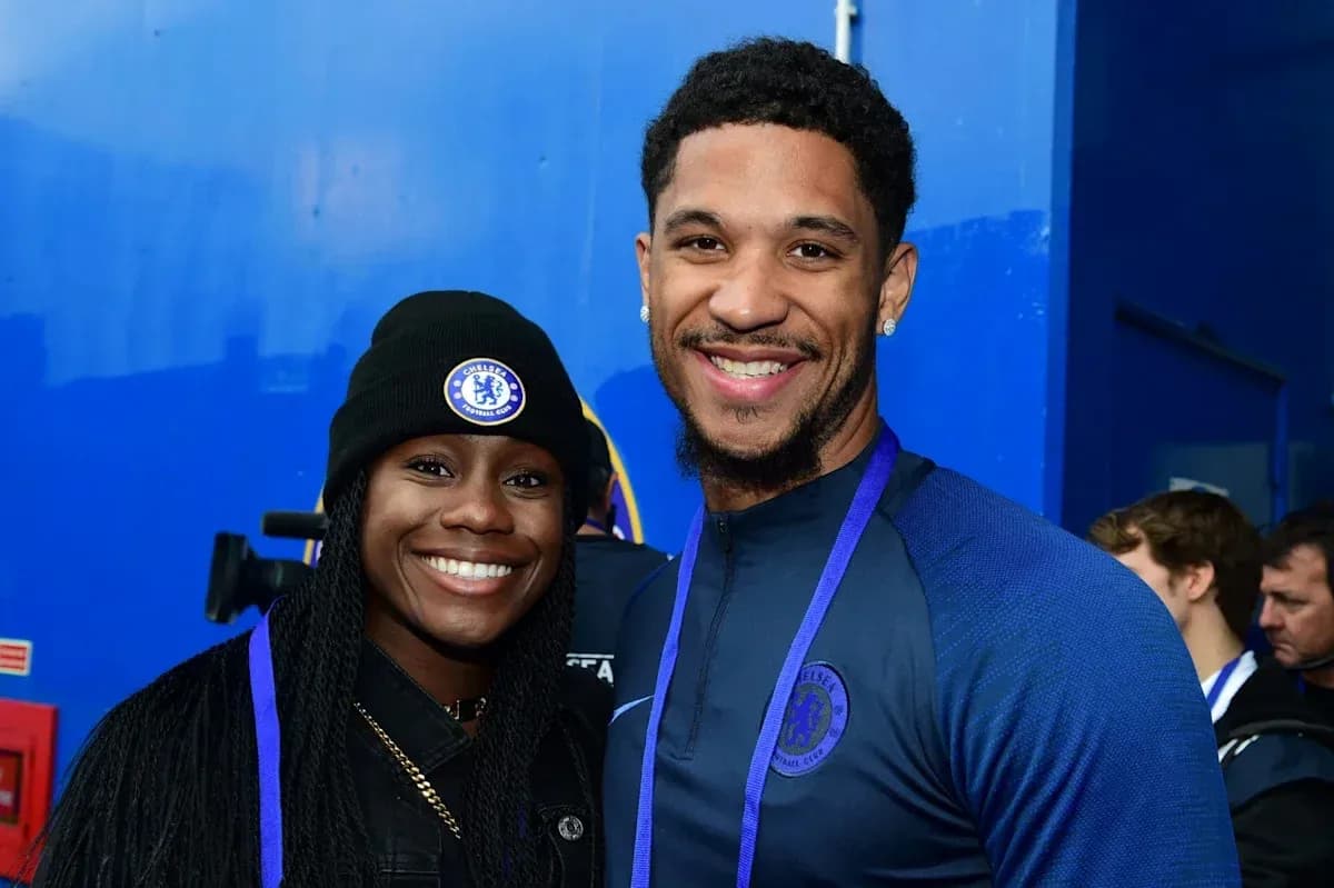 Two people posing together in Chelsea apparel Two people posing together in Chelsea apparel