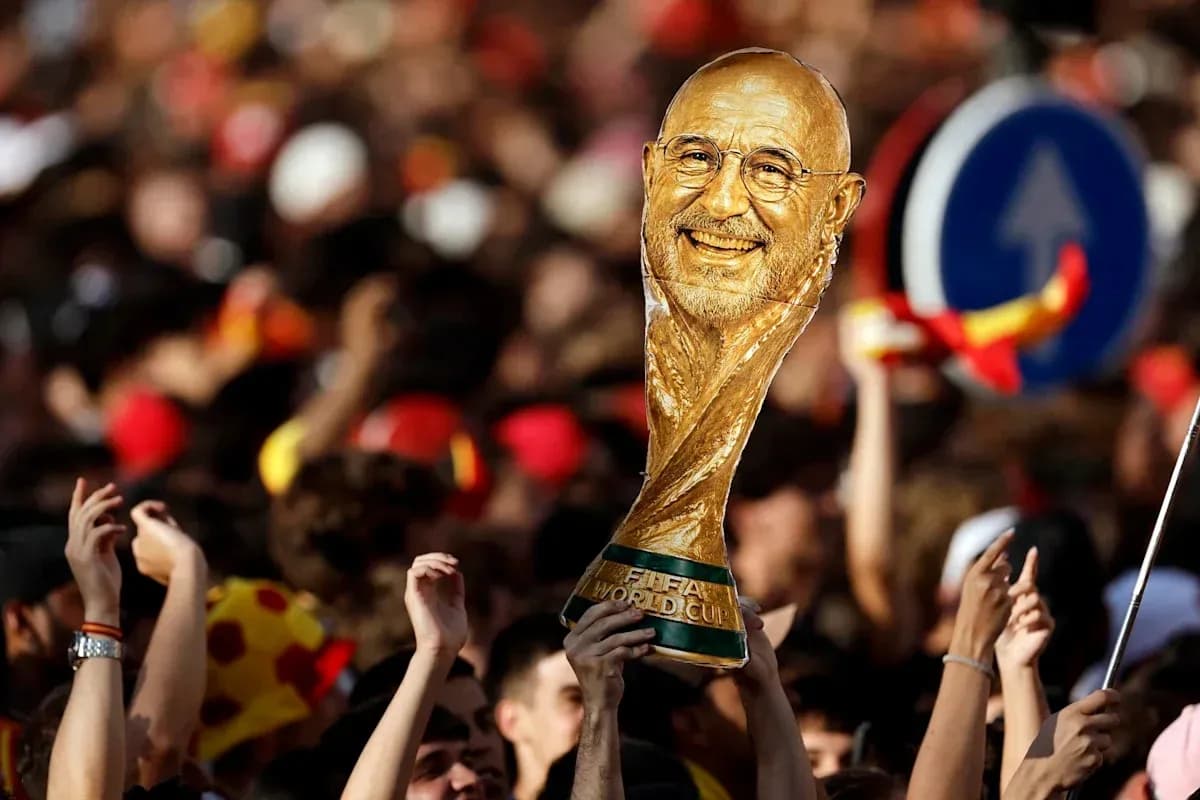 Fan holding FIFA World Cup trophy in crowd Fan holding FIFA World Cup trophy in crowd