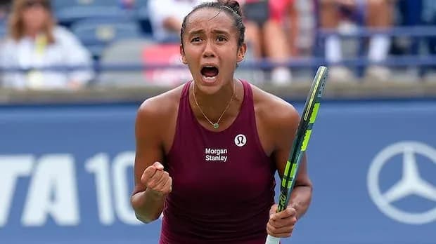 Tennis player celebrating after winning a point Tennis player celebrating after winning a point