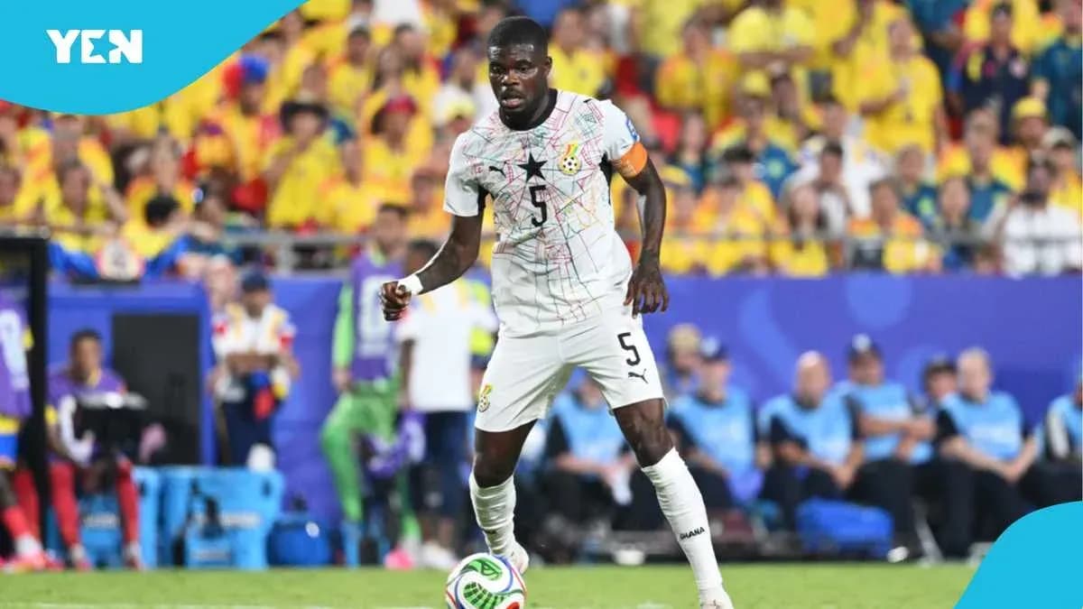 Ghana player dribbling during a football match Ghana player dribbling during a football match