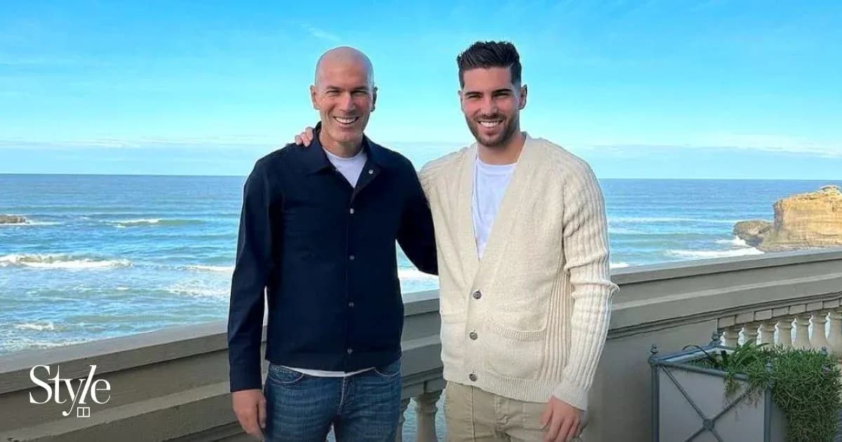 Two men posing by the seaside with ocean view Two men posing by the seaside with ocean view