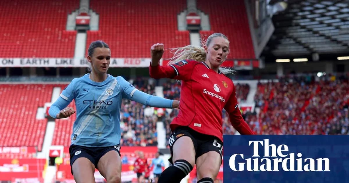 Manchester City and Manchester United players contesting the ball Manchester City and Manchester United players contesting the ball