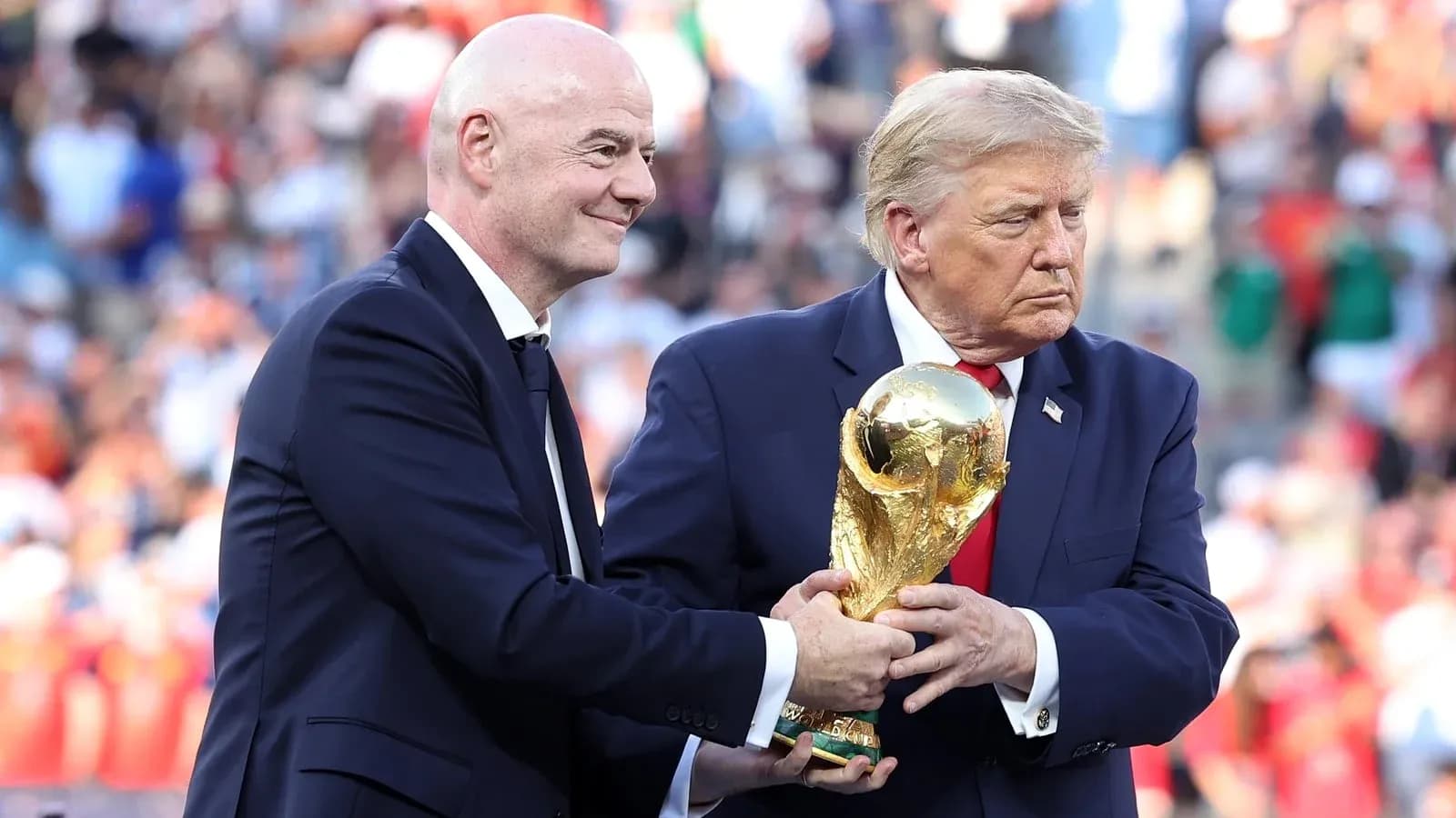 Gianni Infantino and Donald Trump with World Cup trophy Gianni Infantino and Donald Trump with World Cup trophy