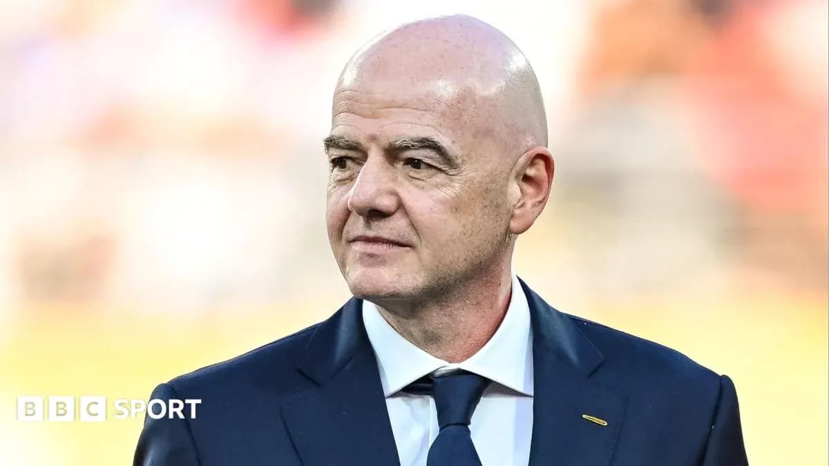 FIFA president standing during event at stadium FIFA president standing during event at stadium