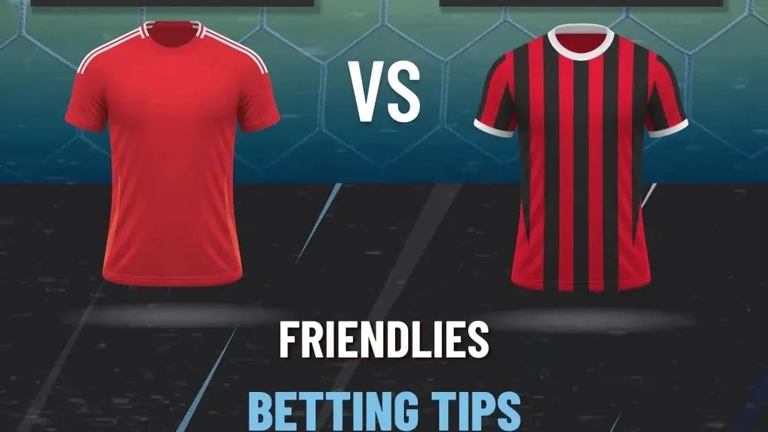 Red and black football jerseys displayed against a goal Red and black football jerseys displayed against a goal