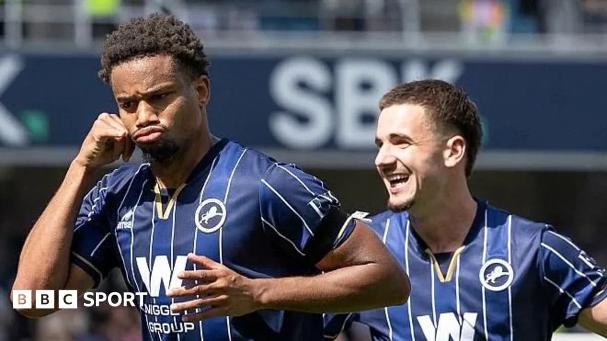 Millwall players celebrating a goal on the field Millwall players celebrating a goal on the field
