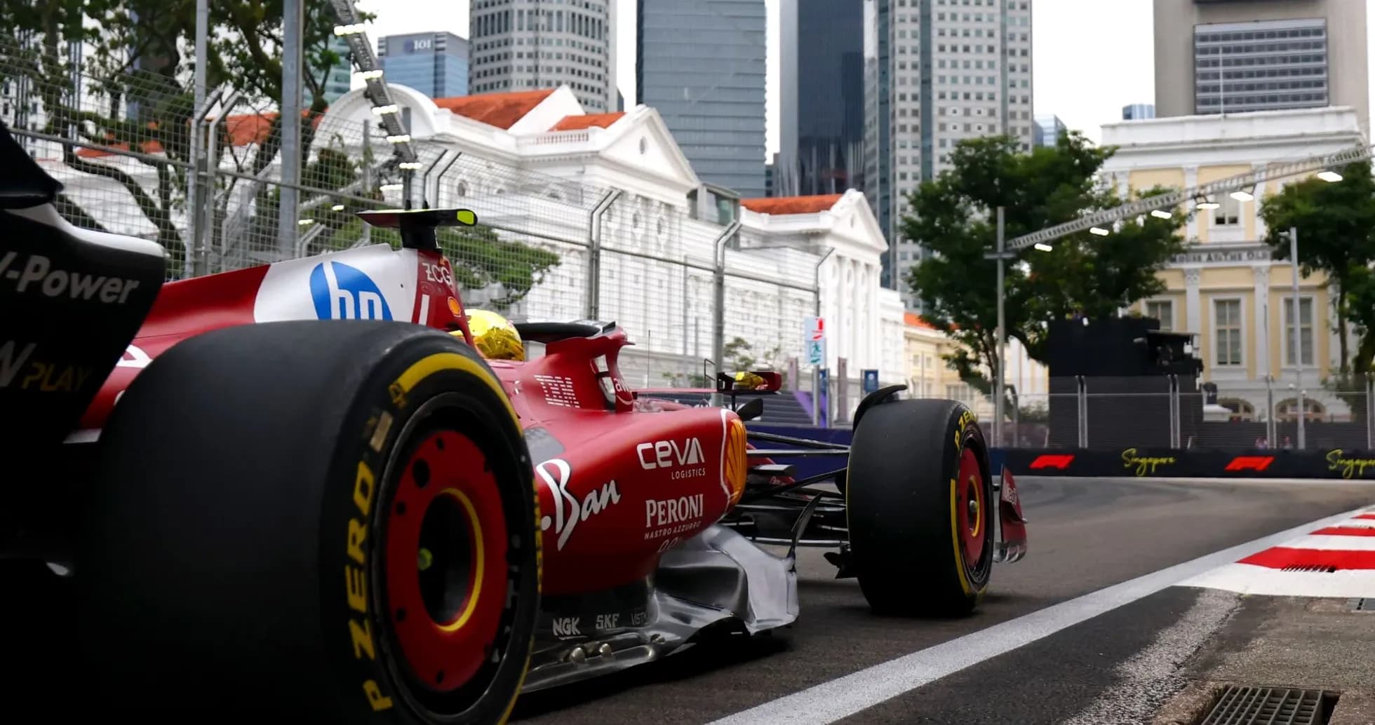 Formula 1 car racing on street circuit in Singapore Formula 1 car racing on street circuit in Singapore