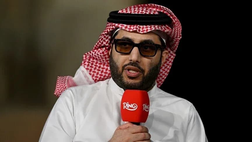 Shirted man speaking into a microphone during interview Shirted man speaking into a microphone during interview