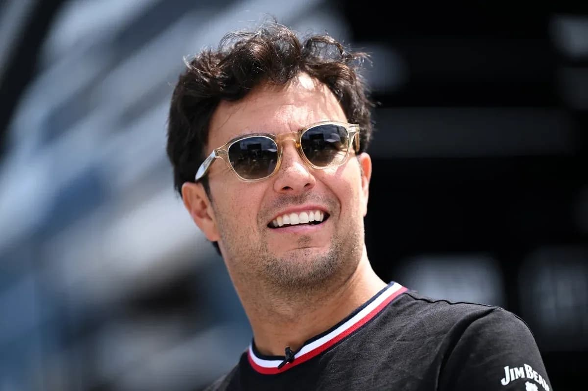 Formula 1 driver wearing sunglasses outdoors Formula 1 driver wearing sunglasses outdoors