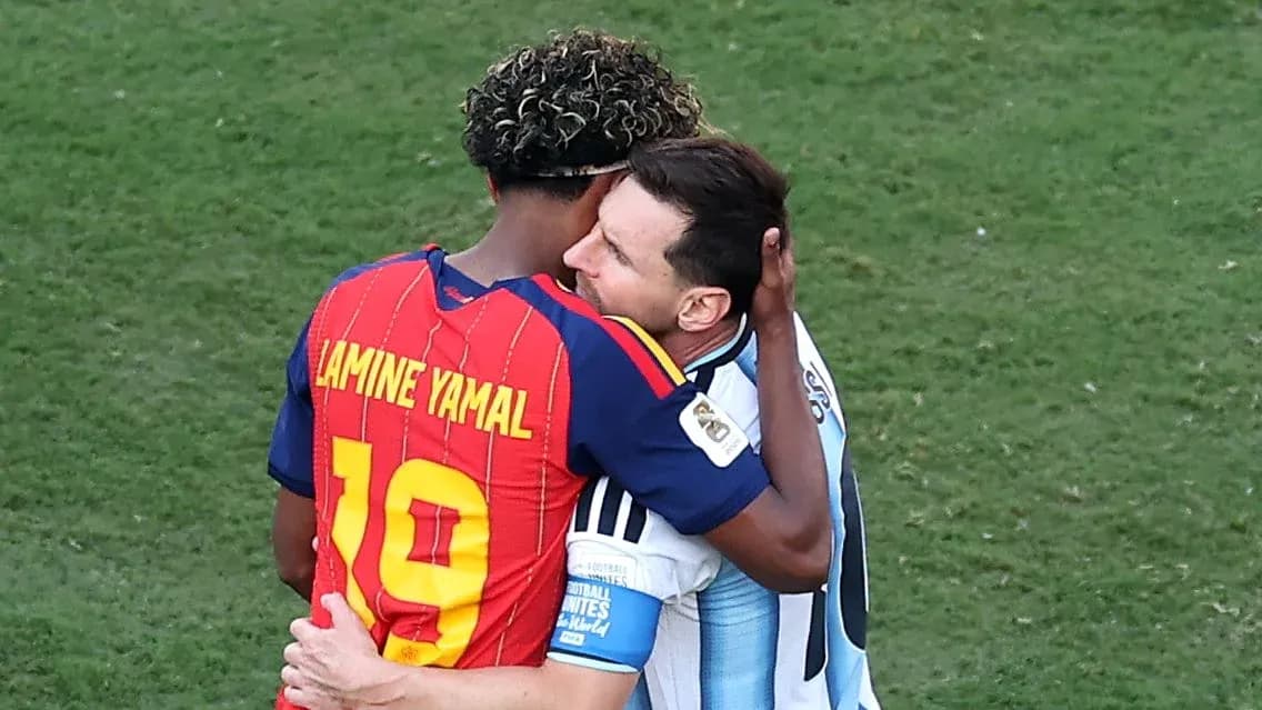 Two football players embracing on the field Two football players embracing on the field