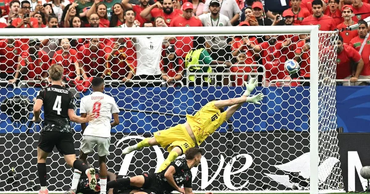 Goalkeeper diving to save a penalty kick attempt Goalkeeper diving to save a penalty kick attempt