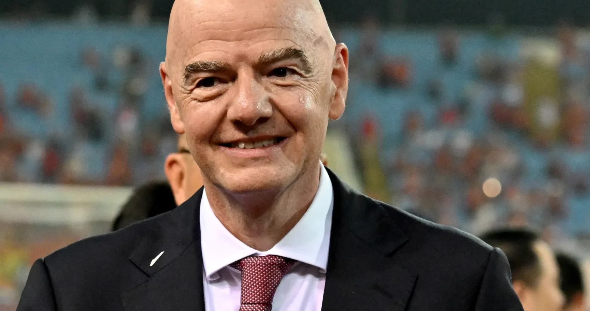 FIFA president smiling at a football event FIFA president smiling at a football event