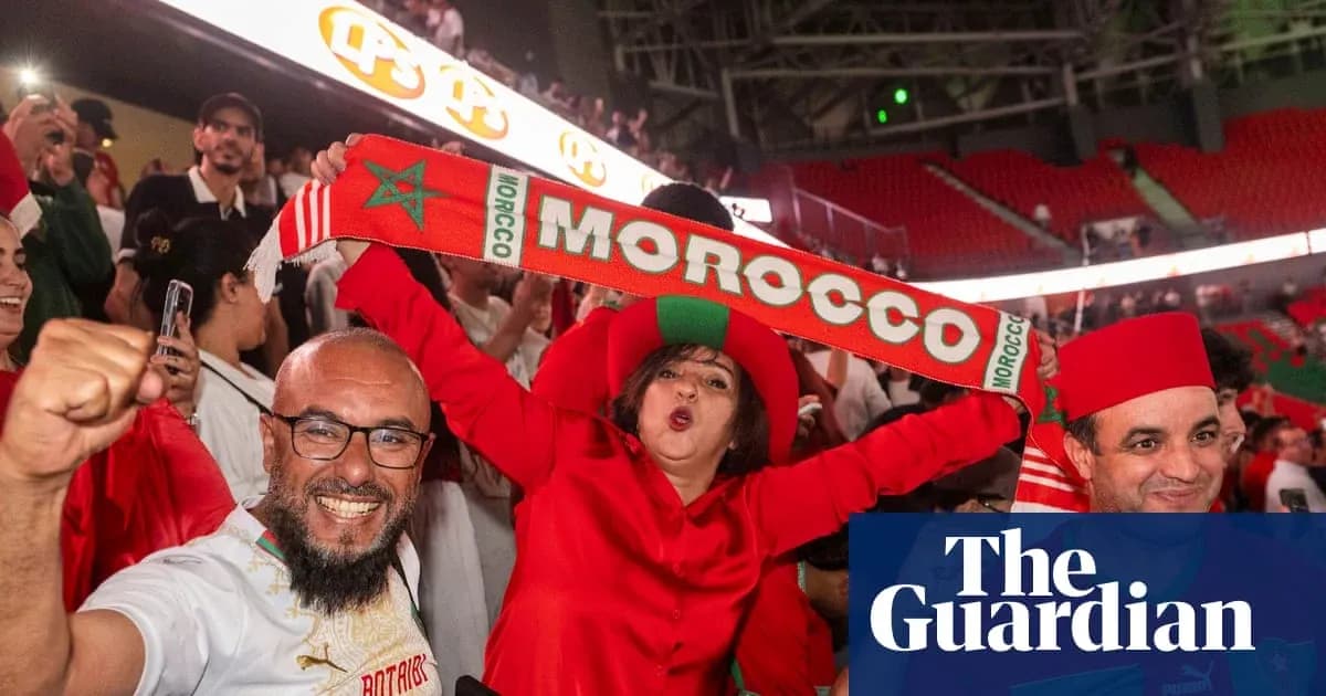Fans celebrating with Morocco scarves in stadium Fans celebrating with Morocco scarves in stadium