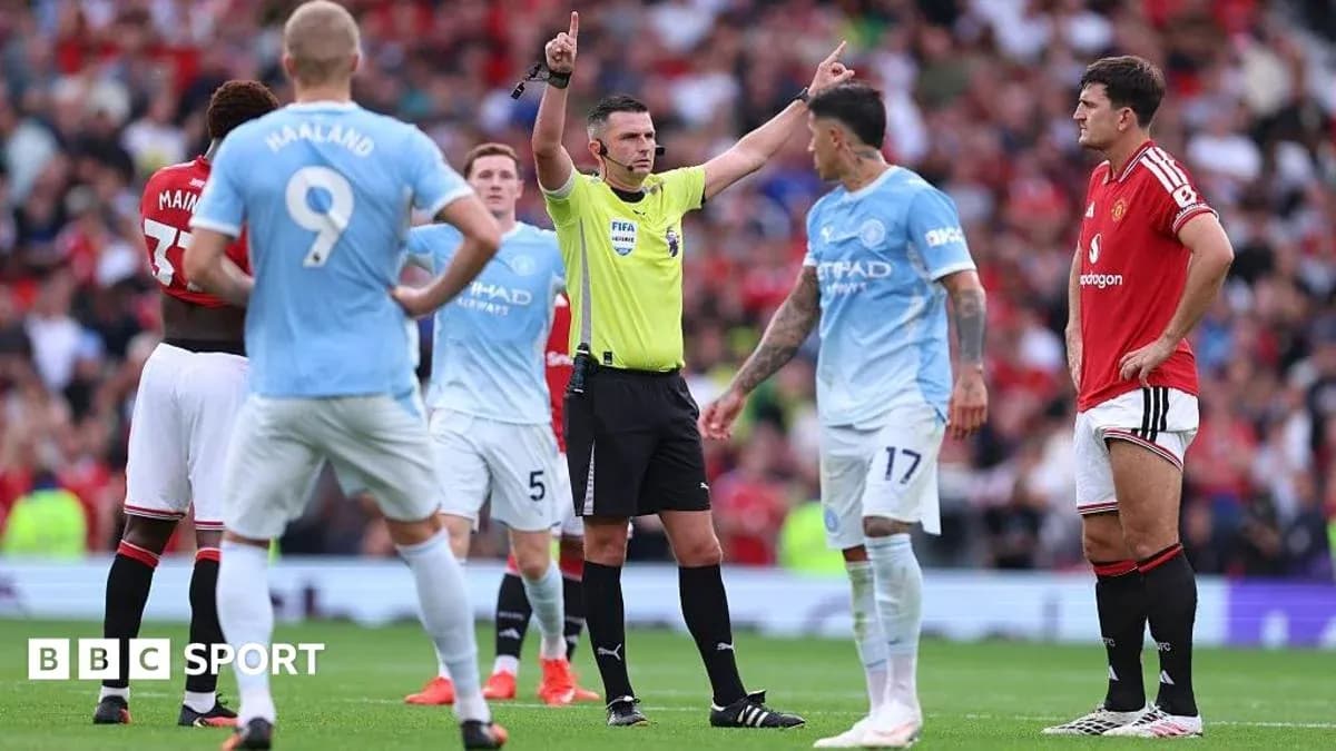Referee signaling during Manchester derby match Referee signaling during Manchester derby match