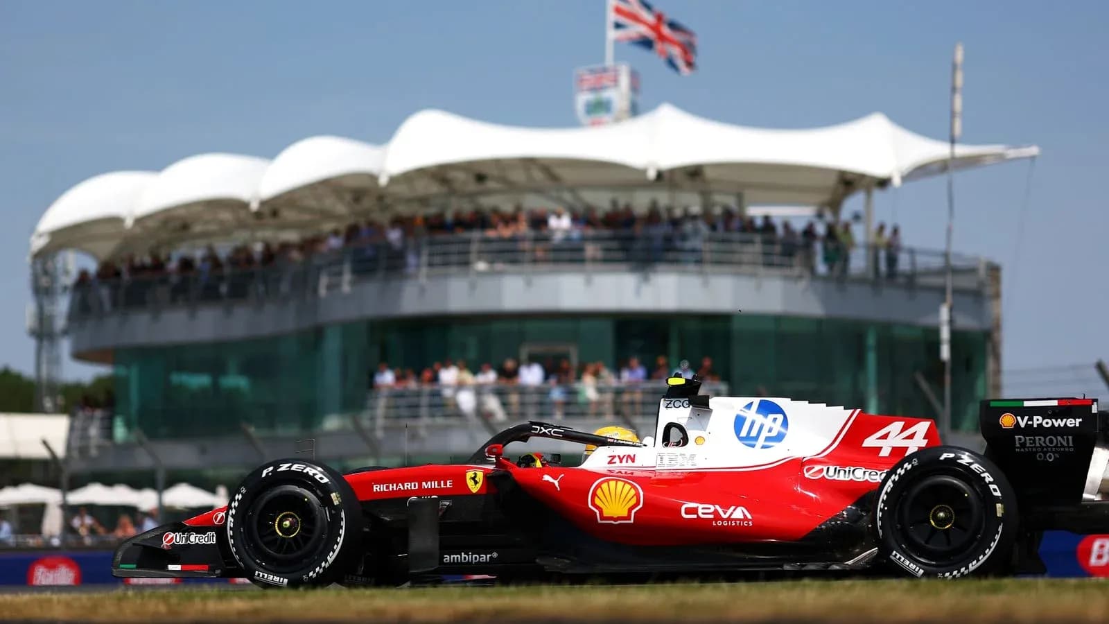 F1 car racing past grandstand during event F1 car racing past grandstand during event