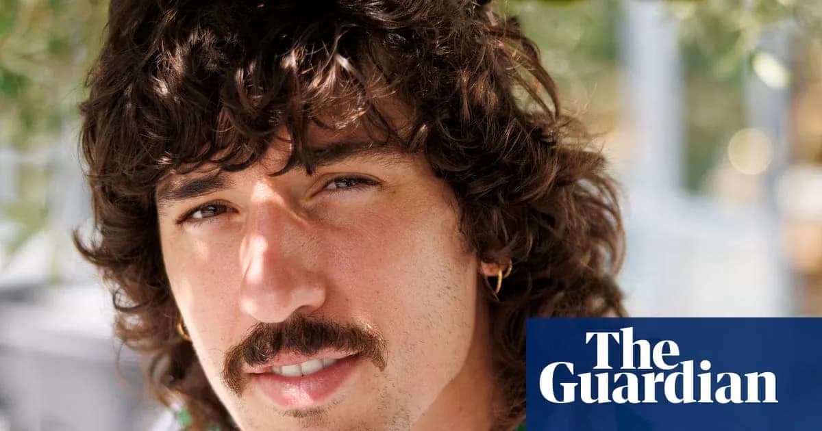 Yoshinobu Yamamoto posing with curly hair Yoshinobu Yamamoto posing with curly hair