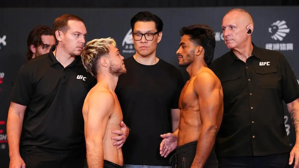Two fighters facing off at weigh-in event Two fighters facing off at weigh-in event