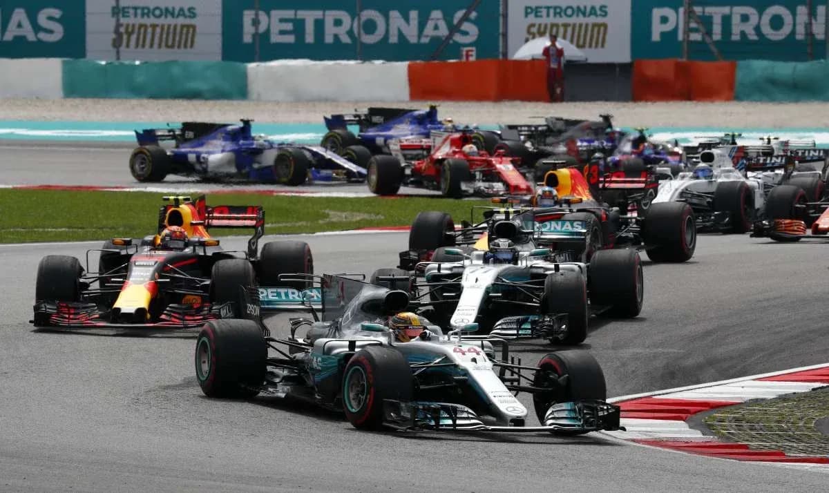 Formula 1 cars racing at a circuit Formula 1 cars racing at a circuit
